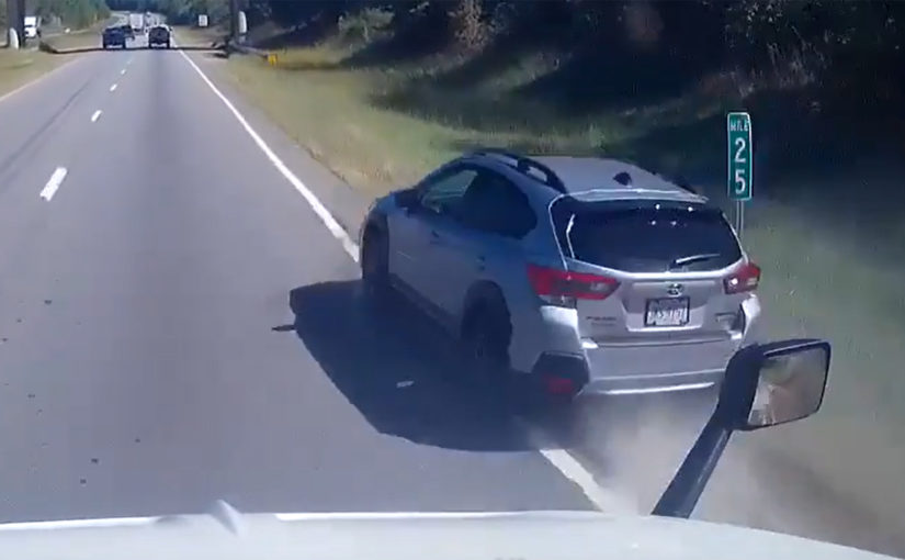 Subaru Driver Attempts To Pass Semi Truck With Two Wheels On The Grass, Barely Makes It Through